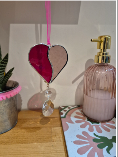 HEART Stained Glass Hanging Suncatcher

This beautiful stained glass heart is perfect as a gift or to add some sparkle to your home.

The stained glass has been assembled with Lead-free solder and reclaimed chandelier glass in Crowborough, East Sussex
